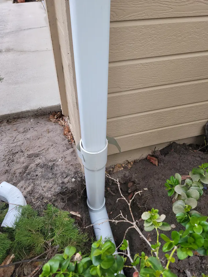 Downspout tied into an underground drain pipe, Bradenton