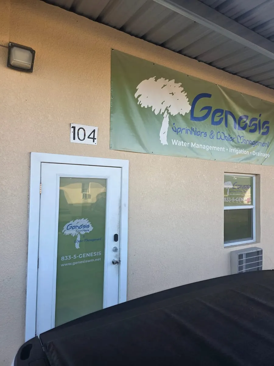 Suite 104 door with the Genesis decal under the Genesis Sprinklers and Water Management banner